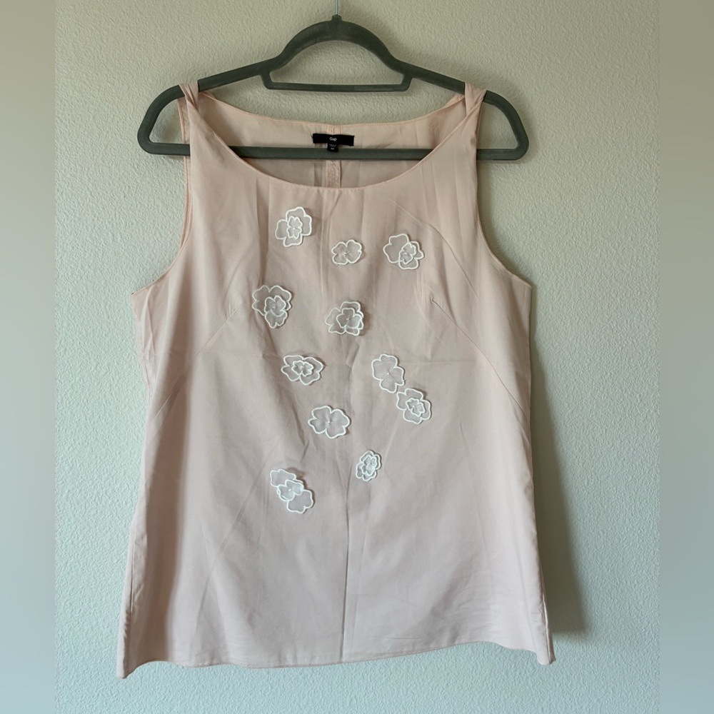 Elegant Pink Sleeveless Top with Floral Accents